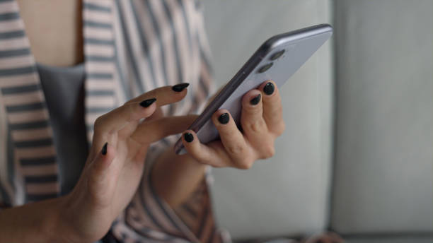 woman closeup hands getting ready to call someone on a smartphone