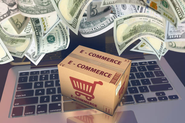 A picture of an e-commerce shipping box on top of a laptop with money raining down.